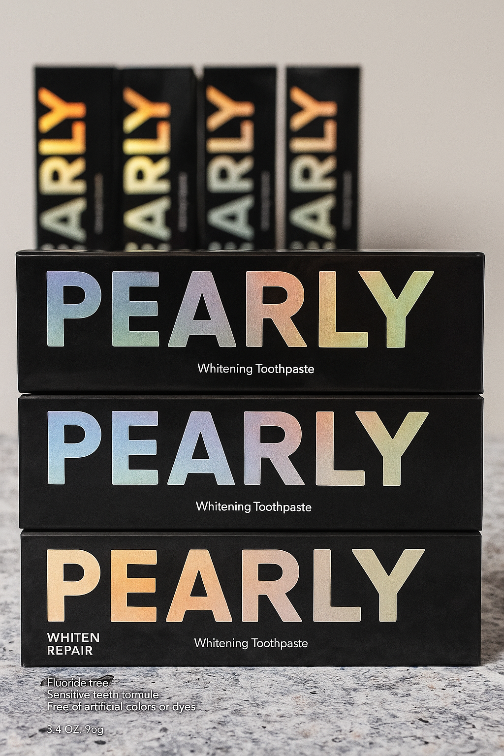 Stack of Pearly Whitening Toothpaste boxes on a gray surface with more boxes in the background.