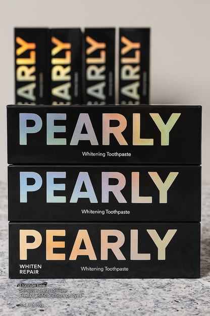 Stack of Pearly Whitening Toothpaste boxes on a gray surface with more boxes in the background.
