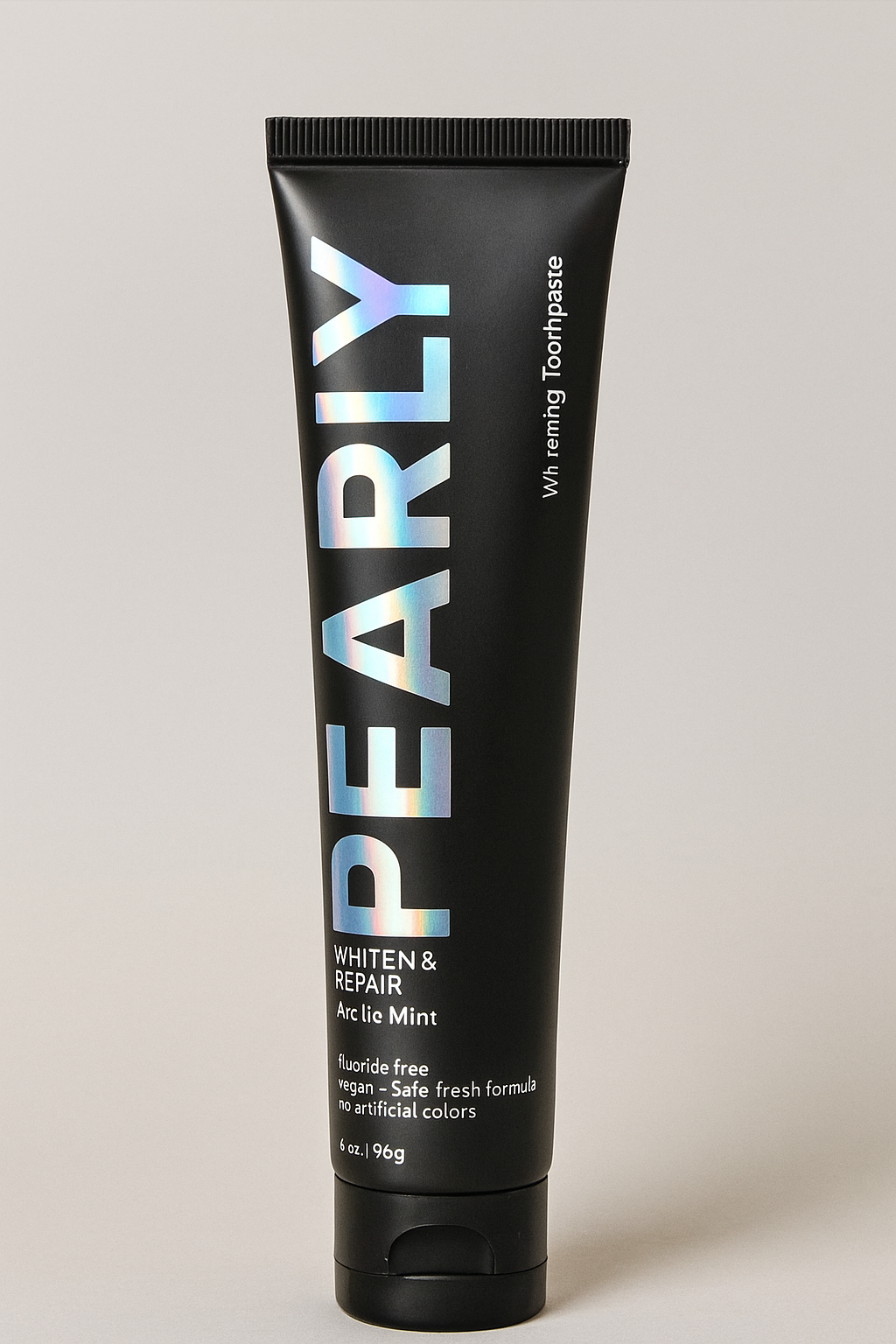 Black toothpaste tube with 'PEARLY' branding on a light gray background
