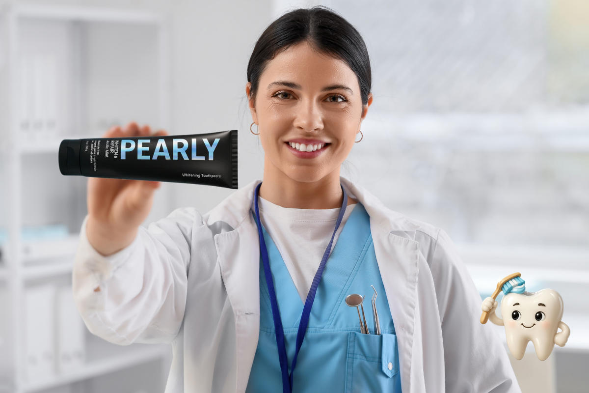 Woman in a medical uniform holding a tube of Pearly toothpaste with a blurred background.